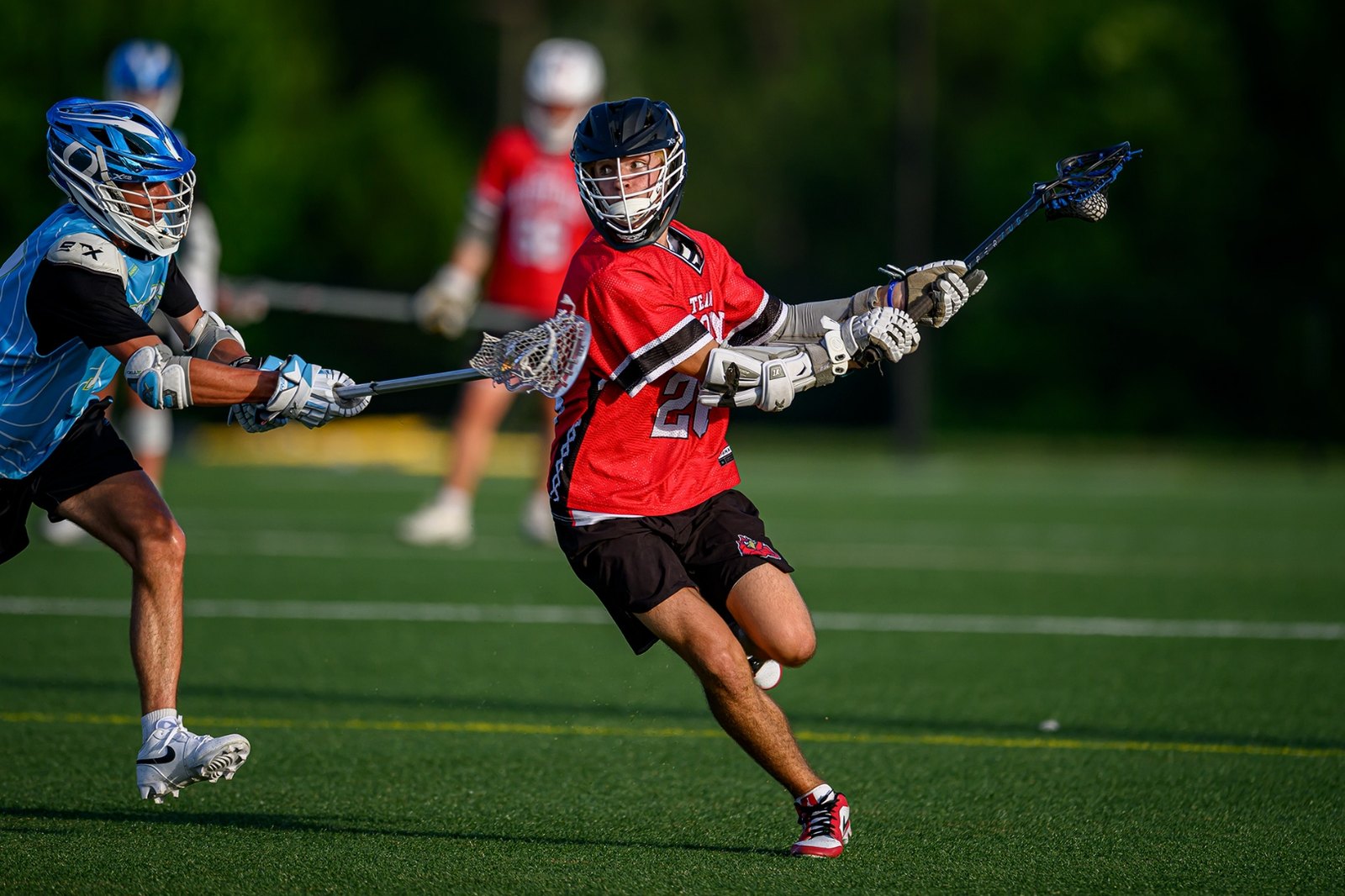 Team Carolina midfielder dodging a Blue Star defender during summer tournament play
