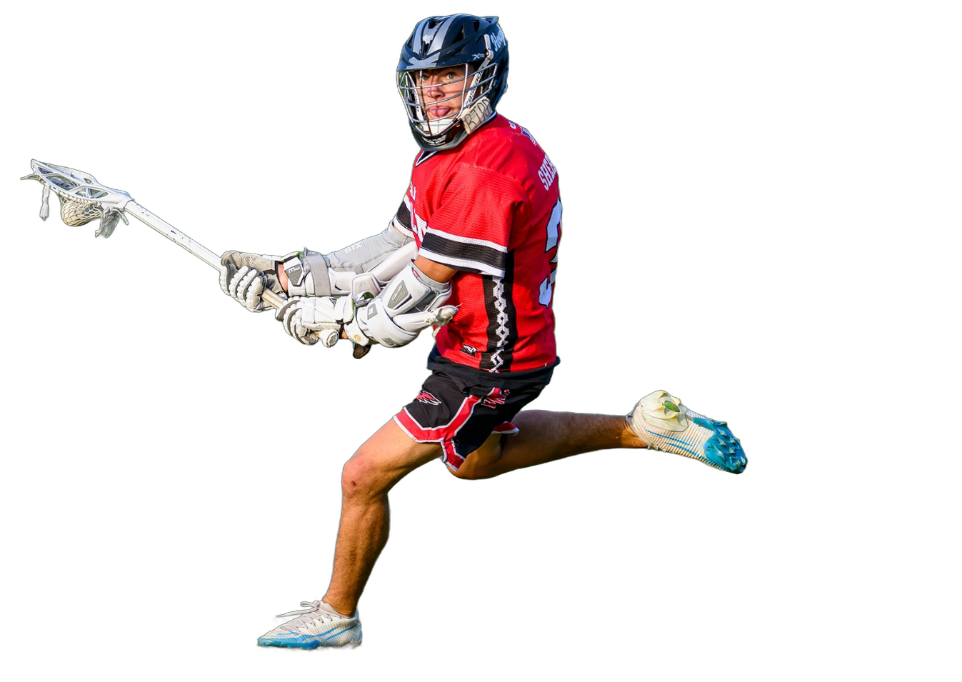Team Carolina Red boys travel lacrosse player driving downfield at a Charlotte tournament